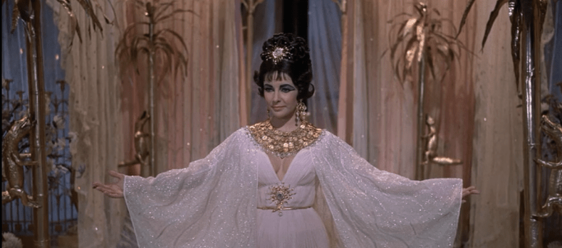 Cleopatra-ElizabethTaylor-GoldCoinDress-ArmsUp